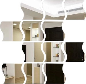 Close-up of 16-piece wavy acrylic mirror wall stickers showing DIY decorative reflection
