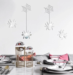 Detail of mirrored acrylic spider and web wall stickers for Halloween party decorations