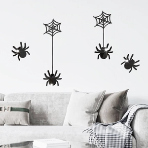 Detail view of black 3D spider and web wall stickers for Halloween party scene decoration