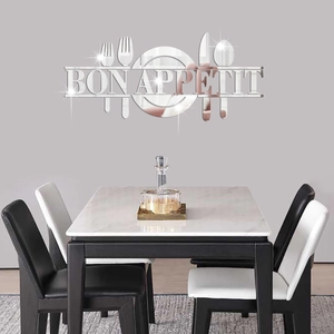 Macro detail of acrylic mirror wall decal featuring cutlery shapes and Bon Appetit text