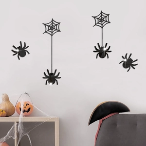 Close-up of black mirror spider wall stickers with 3D reflective finish for Halloween decor