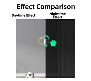 Glow in the dark light switch sticker featuring heart and cat paw prints in night view