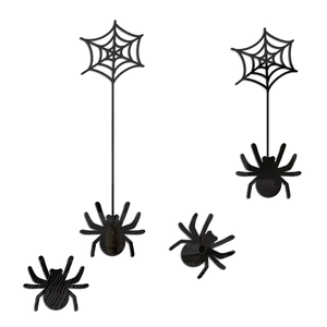Detail view of four black 3D acrylic spider wall stickers for Halloween party decoration