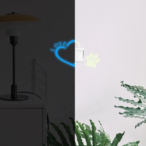 Luminous heart and paw print switch stickers showing day and night glow effect
