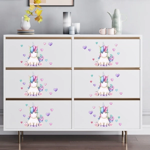 Modern white six-drawer dresser featuring watercolor unicorn stickers and gold metal handles