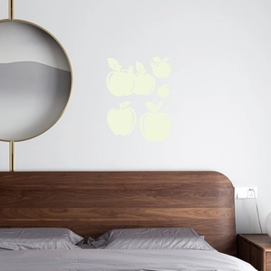 Luminous apple wall stickers in a bedroom setting for glow in the dark kids room decor