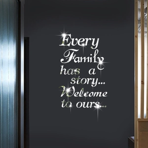 Macro detail of silver acrylic mirror wall sticker with Every Family quote on grey wall