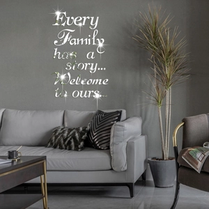 Detail of 3D mirror acrylic wall art featuring family quote on minimalist grey wall