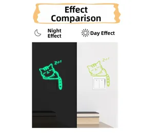 Glow-in-the-dark cat wall sticker showing day and night luminous effect contrast