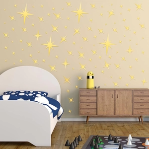 Detailed view of yellow star-shaped acrylic mirror wall stickers in a child bedroom setting
