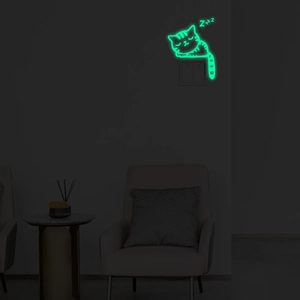 Glow-in-the-dark cat wall sticker shown emitting green light above a light switch