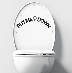 Macro detail of Put Me Down creative toilet lid sticker with pointing finger icon