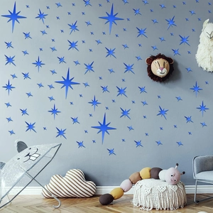 Detailed view of blue 3D star wall stickers in a cozy minimalist nursery setting