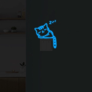Luminous blue cat wall sticker glowing on a light switch in a dark room environment