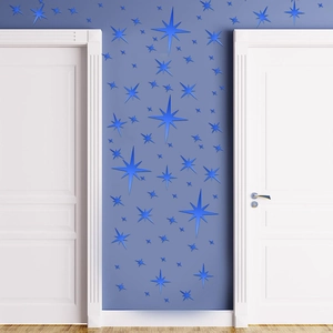 Close-up of blue 3D star mirror wall stickers on a background wall for home decor