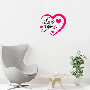 Close-up of heart wall sticker with 'I love you' text in a modern living room