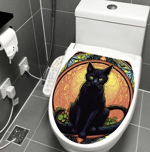 Detail view of a cat bathroom sticker in stained glass style on a white toilet lid