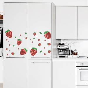 Vibrant strawberry wall stickers applied to white kitchen cabinets for home decoration