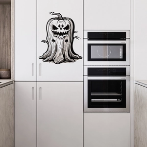 Halloween pumpkin monster wall sticker on white kitchen cabinet with spooky branch motifs