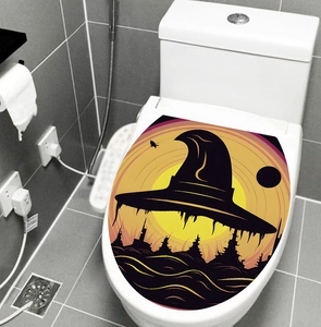 Detail view of a Halloween toilet lid decal featuring a witch hat and full moon silhouette