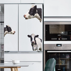 Creative 3D cow wall stickers for refrigerator decor in a modern kitchen setting