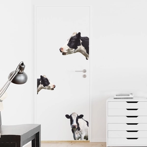 Creative cow pattern self-adhesive wall stickers on a white bedroom door in a modern room