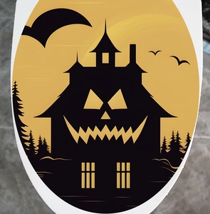 Detailed view of Halloween pumpkin silhouette decal applied on a white toilet lid