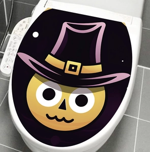 Close-up of Halloween cartoon wizard sticker applied on a white toilet lid surface