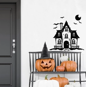 Detail view of black Halloween haunted house wall decals on white wall with bats and pumpkins
