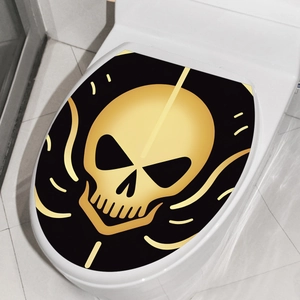 Halloween toilet seat lid cover sticker featuring a golden skull on a black background
