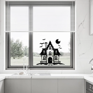 Halloween window decal featuring a dark haunted castle silhouette with bats and moon