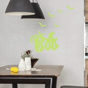 Luminous Halloween wall stickers featuring Boo text and bats in a modern dining room
