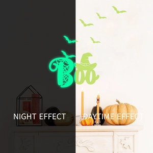 Luminous Halloween Boo wall decals with bats and spider webs showing night glow effect
