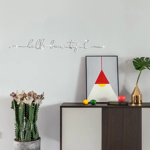 Modern 3D silver mirror acrylic wall decal with hello beautiful lettering on grey wall