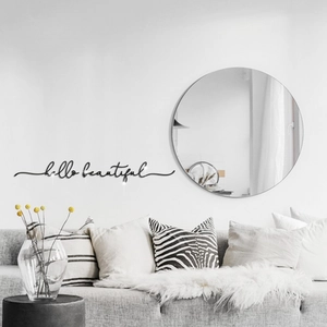 Modern black Hello Beautiful acrylic wall stickers with a round mirror over a sofa