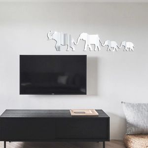 Detail view of 4-piece elephant family acrylic mirror wall decals in a modern living room