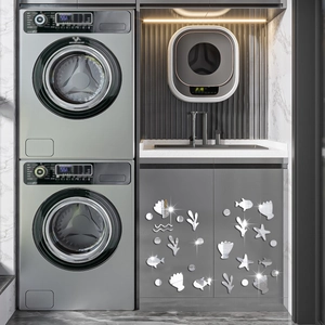 Modern ocean themed silver acrylic mirror wall stickers on grey cabinets in laundry room