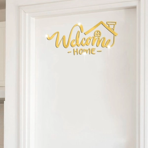 Golden mirror Welcome Home wall sticker with house outline on white door side wall