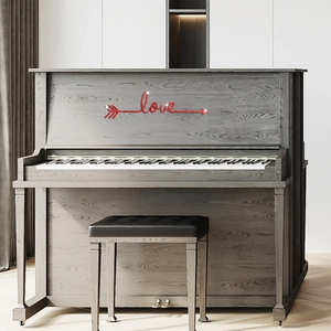 Detail view of red Love arrow acrylic wall sticker on a minimalist dark piano surface