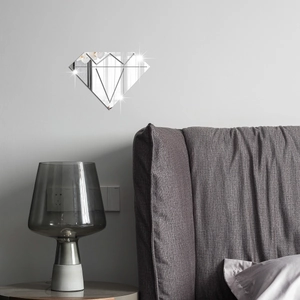 Close-up of diamond-shaped mirror wall stickers in a modern minimalist bedroom setting