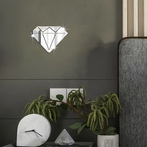Close-up of diamond shaped mirror wall stickers with geometric lines in a modern room