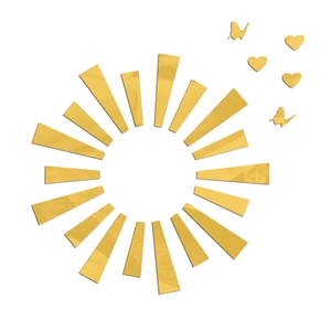 Macro detail of sunburst acrylic wall decals featuring golden mirror heart and butterfly