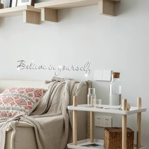 Macro view of silver acrylic mirror wall sticker with Believe in yourself quote