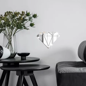 Modern diamond-shaped mirror wall stickers in a minimalist living room setting