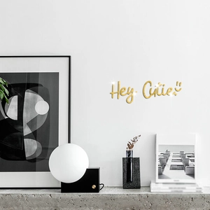 Golden acrylic mirror wall sticker featuring Hey Cutie phrase with smiley face decor