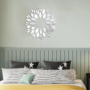Detail view of sunflower mirror wall stickers made of acrylic on a green bedroom wall