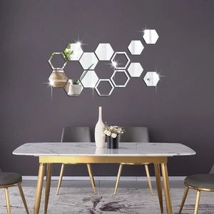 Detail view of hexagonal acrylic mirror stickers arranged in a modern honeycomb wall pattern