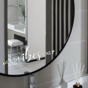 Detail of Good Vibes Only quote acrylic 3D mirror wall decal on bathroom mirror surface
