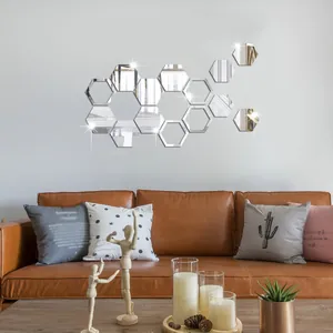 Detailed view of silver hexagonal acrylic mirror wall stickers in a cozy living room setting