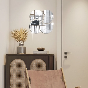 Detail showing high-quality mirror wall stickers arranged in a geometric clover pattern